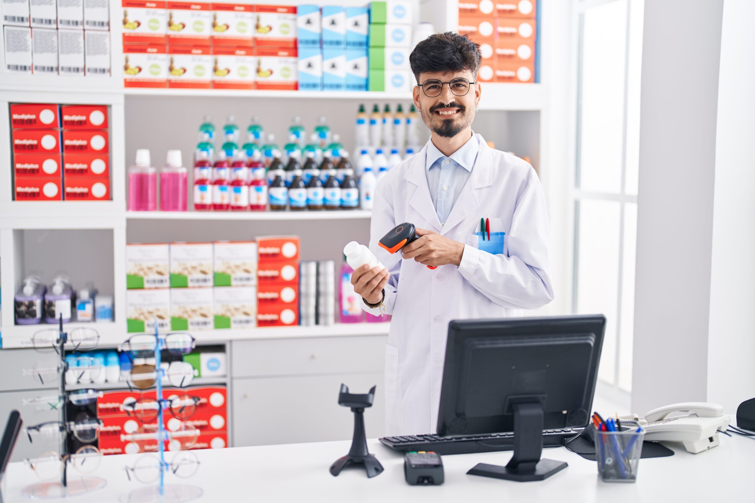 Pharmacy Torix   Young Hispanic Man Pharmacist Smiling Confident Scanning Pills Bottle Pharmacy Scaled 